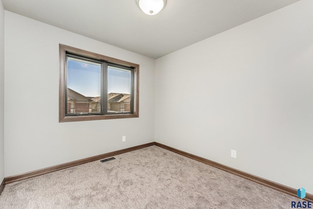 unfurnished room featuring carpet