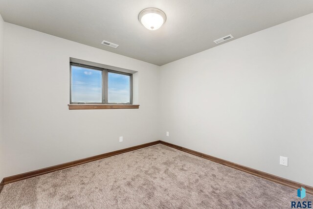 empty room with carpet flooring