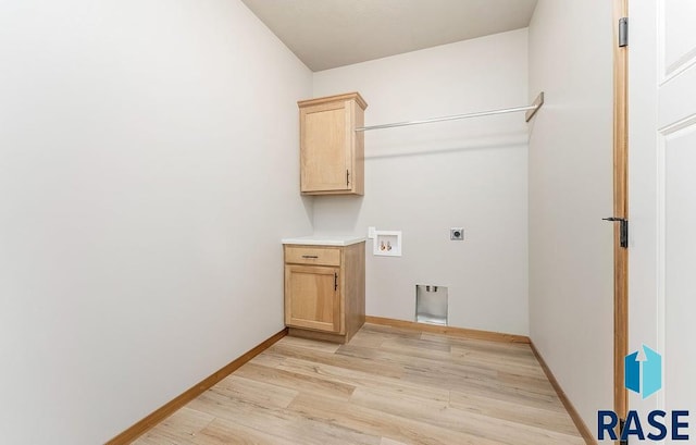 1437 N Mae Pl, Tea, SD 57064 - clothes washing area featuring cabinets, hookup for a washing machine, light hardwood / wood-style flooring, and hookup for an electric dryer