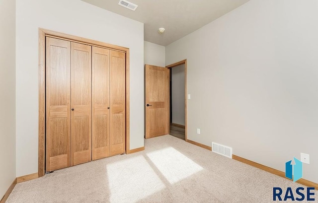 1437 N Mae Pl, Tea, SD 57064 - unfurnished bedroom with light colored carpet and a closet