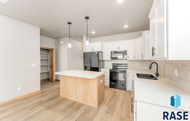1437 N Mae Pl, Tea, SD 57064 - kitchen with sink, white cabinetry, a center island, stainless steel fridge with ice dispenser, and range with electric stovetop