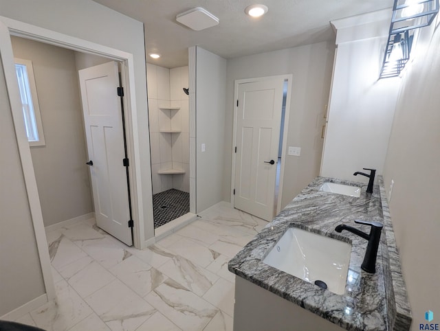 bathroom featuring double vanity, tile flooring, and a tile shower