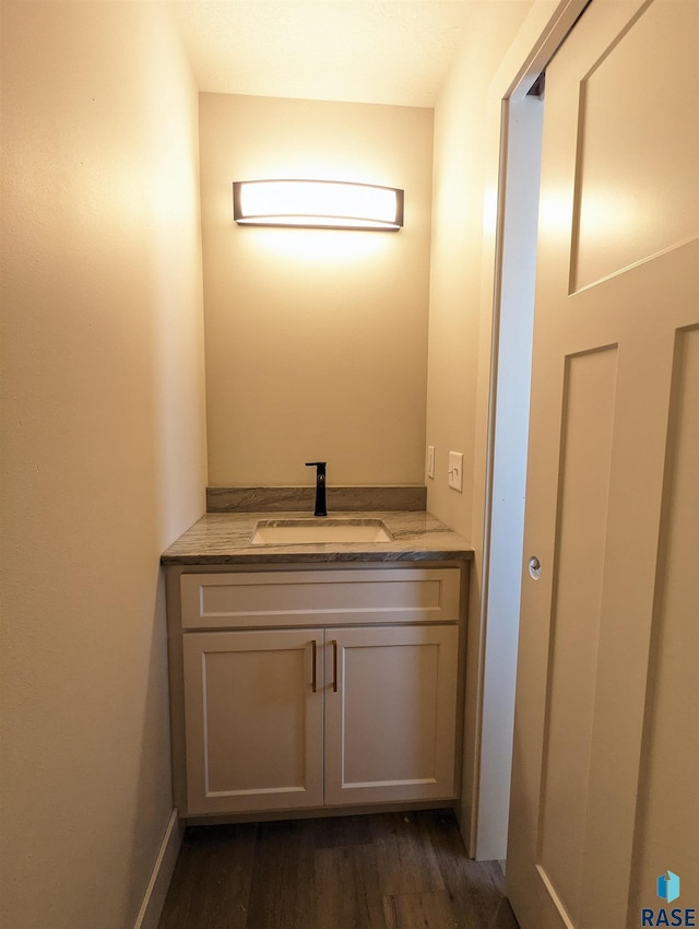 bathroom featuring vanity and hardwood / wood-style flooring