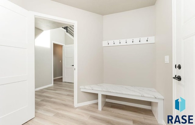 mudroom with light hardwood / wood-style floors