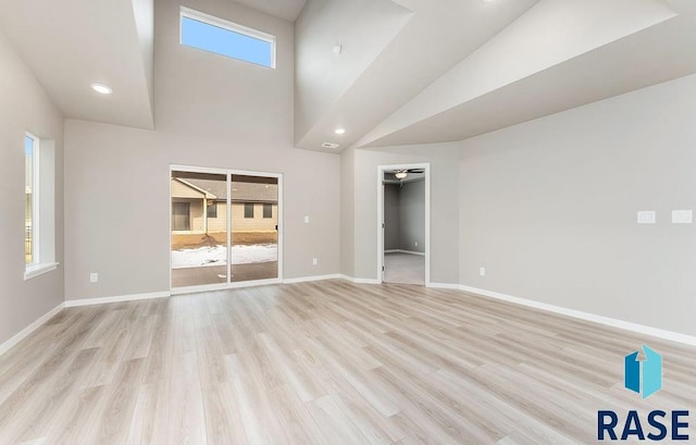 interior space with ceiling fan and light hardwood / wood-style floors