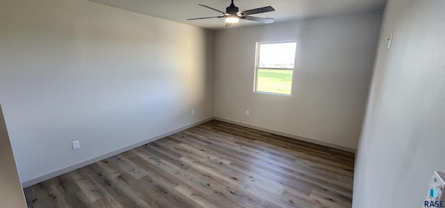 spare room with wood-type flooring and ceiling fan