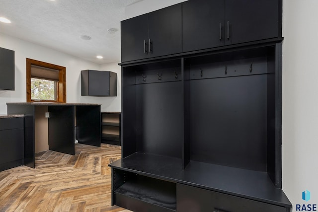 mudroom featuring light parquet flooring