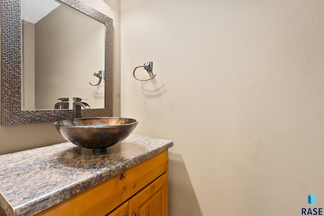 bathroom with vanity with extensive cabinet space