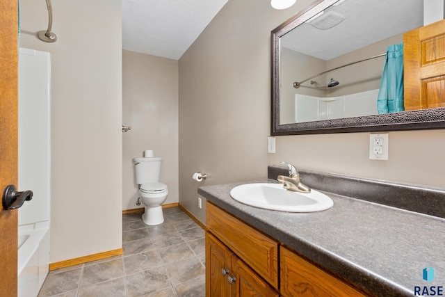 full bathroom featuring washtub / shower combination, tile flooring, vanity, and toilet