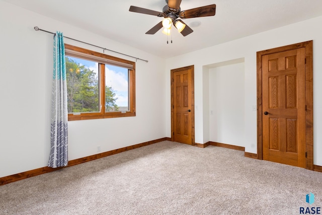 unfurnished bedroom with carpet and ceiling fan