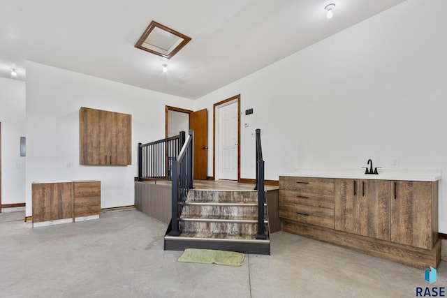 stairway with concrete floors