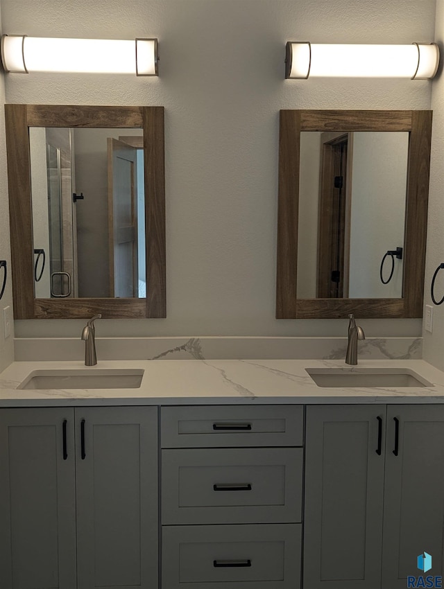 bathroom with dual bowl vanity