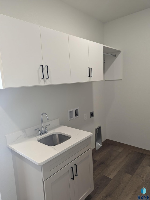 clothes washing area with cabinet space, dark wood-style floors, a sink, washer hookup, and electric dryer hookup