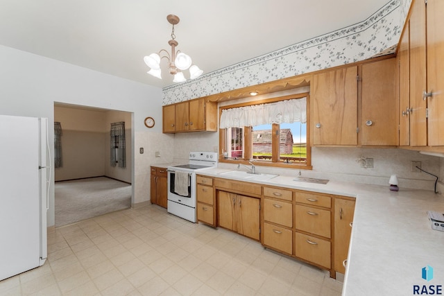 kitchen featuring sink, an inviting chandelier, light colored carpet, pendant lighting, and white appliances