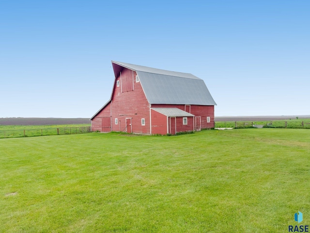 exterior space featuring a yard and a rural view