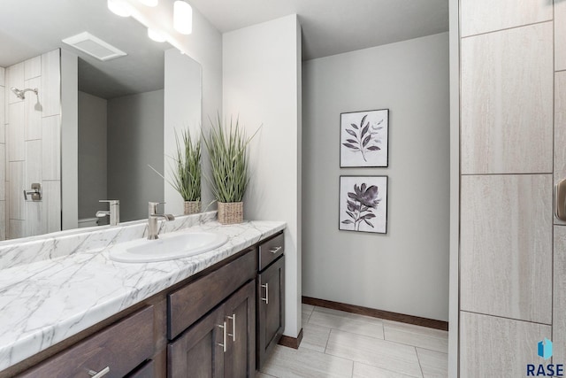 bathroom with tile patterned flooring and vanity