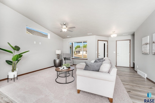 living room with ceiling fan and light wood-type flooring