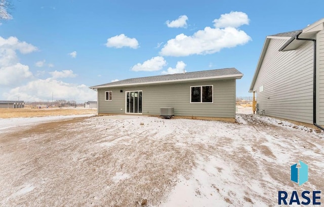 rear view of property featuring central AC unit