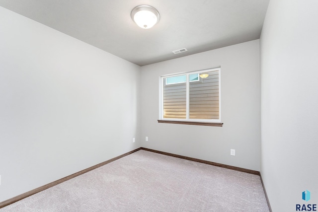 spare room featuring carpet flooring