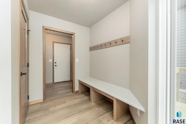 mudroom with light hardwood / wood-style flooring