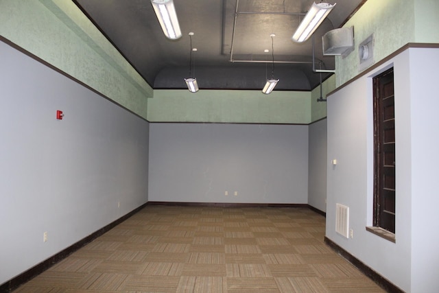 empty room featuring a high ceiling