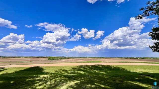 view of nearby features with a yard and a rural view