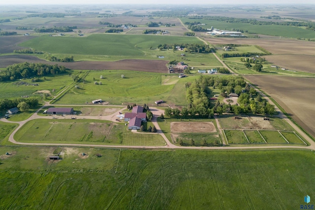 birds eye view of property with a rural view