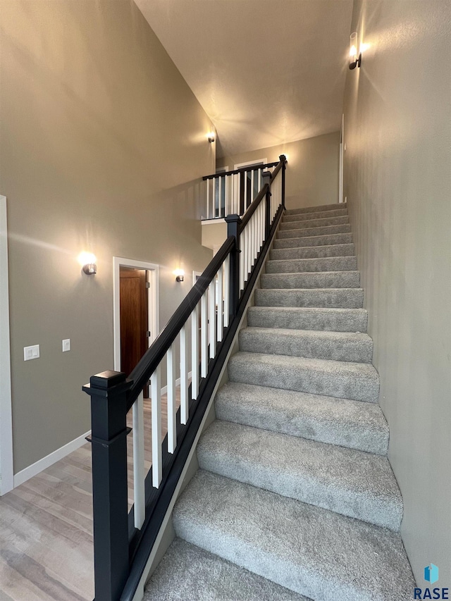 stairway featuring hardwood / wood-style floors