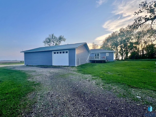 garage featuring a lawn