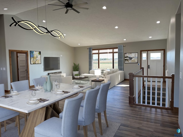 dining area featuring ceiling fan, dark hardwood / wood-style flooring, and vaulted ceiling