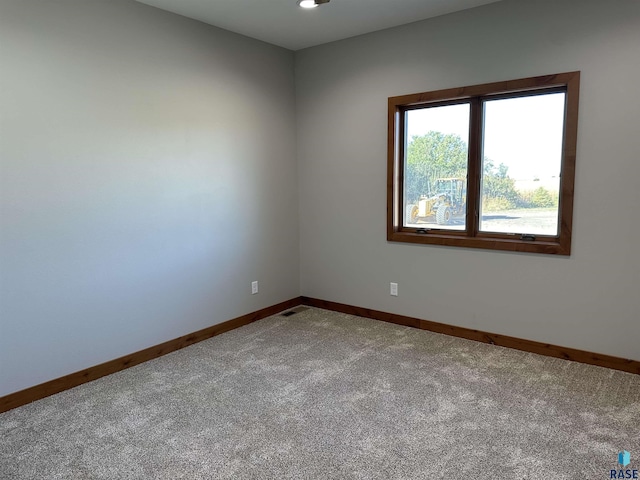 empty room featuring carpet flooring