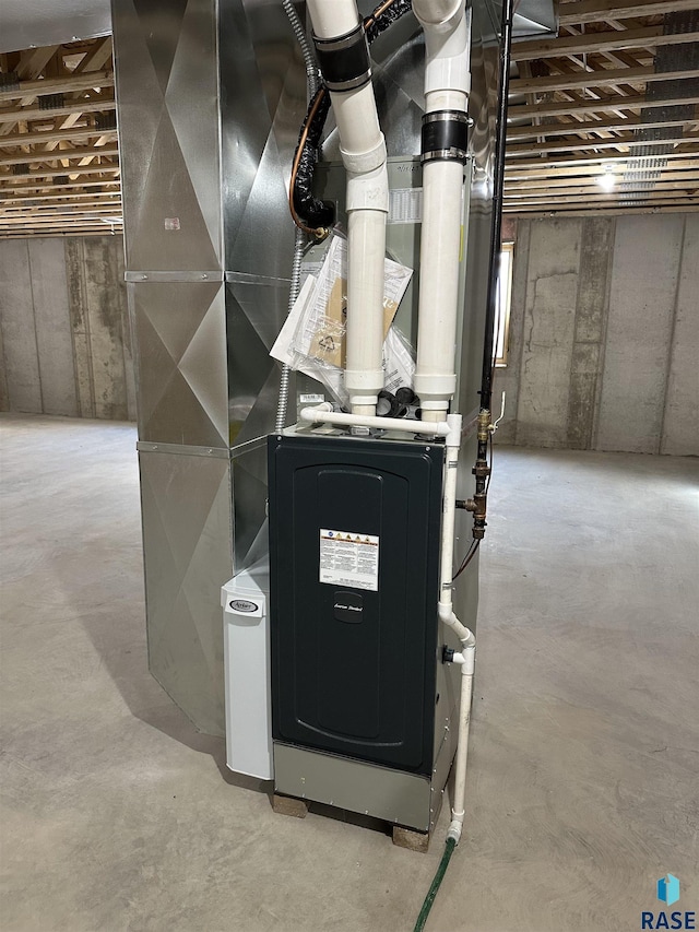 utility room with heating unit