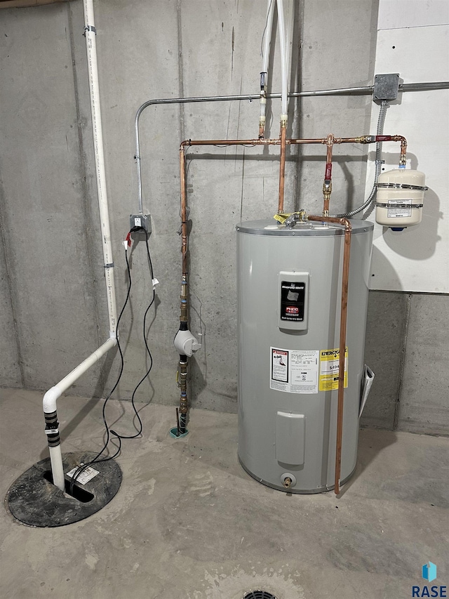 utility room featuring electric water heater