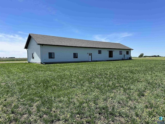 view of property exterior with a yard