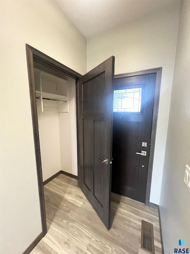 foyer with light hardwood / wood-style floors