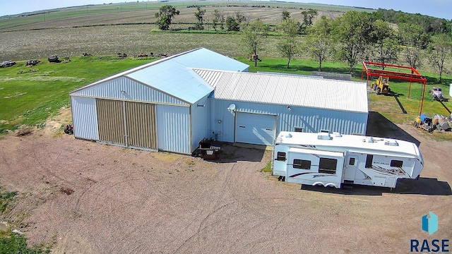 birds eye view of property featuring a rural view