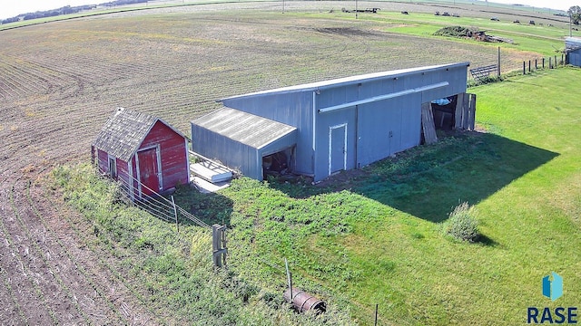 birds eye view of property featuring a rural view