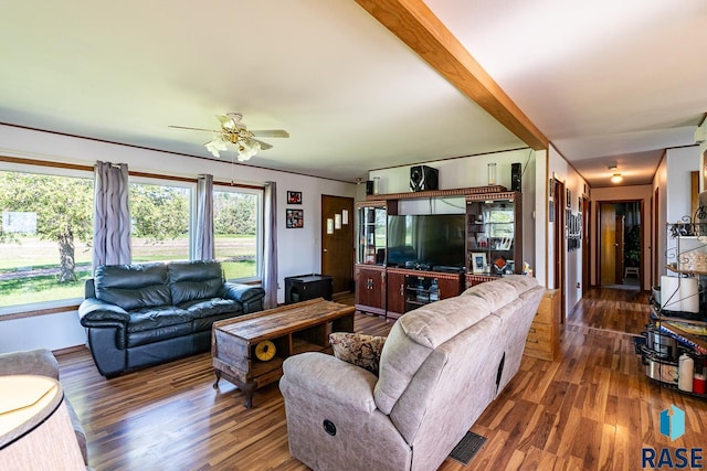 living room with beam ceiling, dark hardwood / wood-style flooring, and ceiling fan