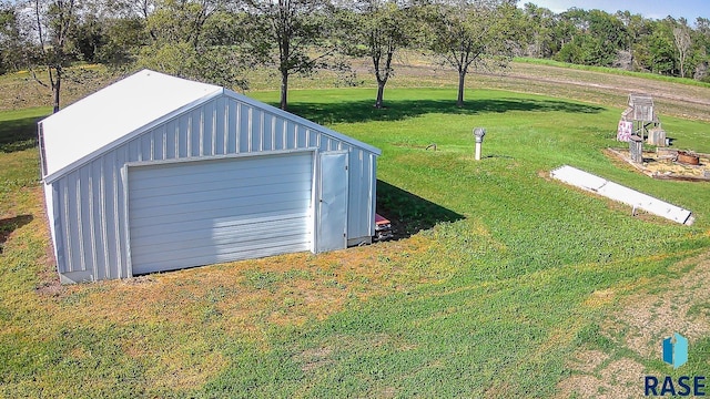 garage featuring a lawn