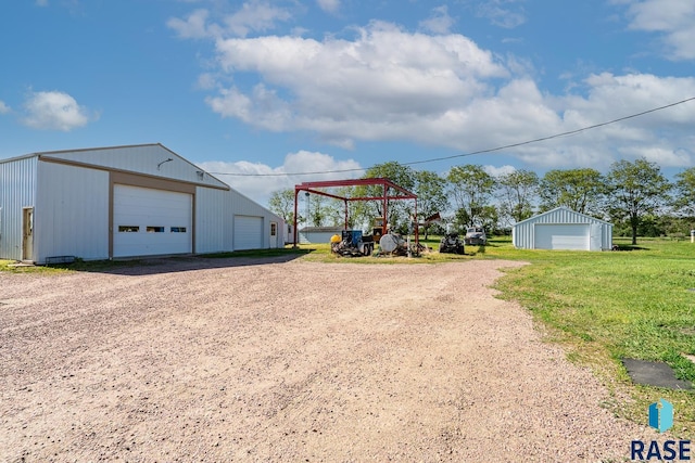 view of yard with an outbuilding and a garage