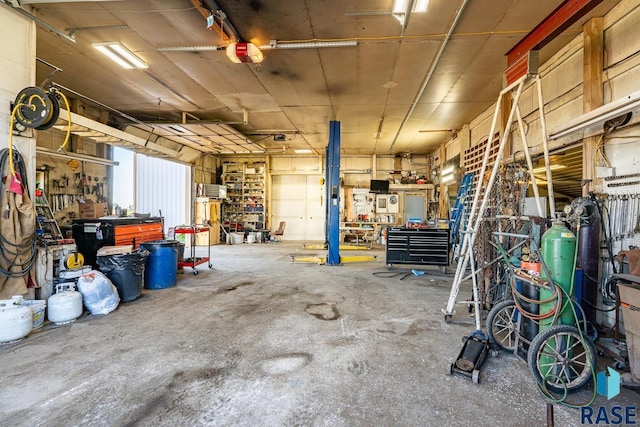 garage featuring a workshop area and a garage door opener