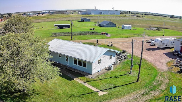 birds eye view of property featuring a rural view