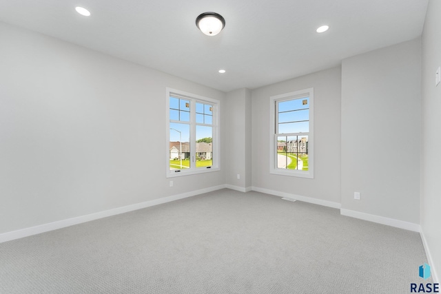 empty room featuring carpet flooring