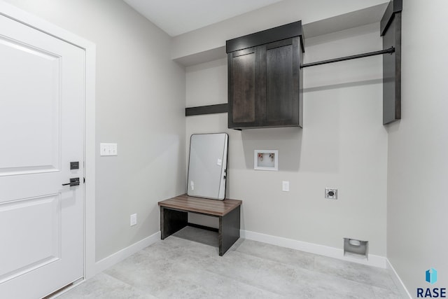 washroom featuring cabinets, washer hookup, and hookup for an electric dryer