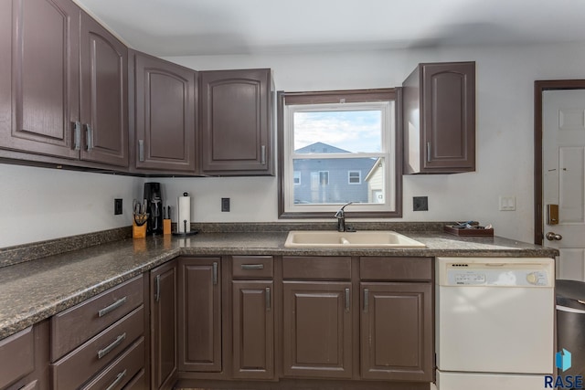 kitchen with white dishwasher, dark brown cabinetry, and sink