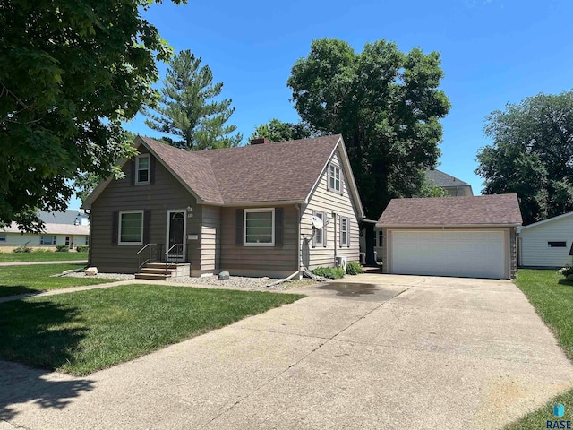 view of front of property with a garage and a front lawn