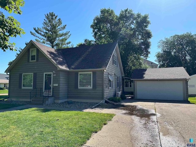 view of front facade with a front yard and a garage