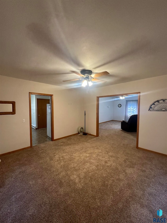 interior space with carpet flooring and ceiling fan