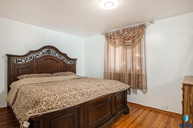 bedroom featuring dark hardwood / wood-style flooring