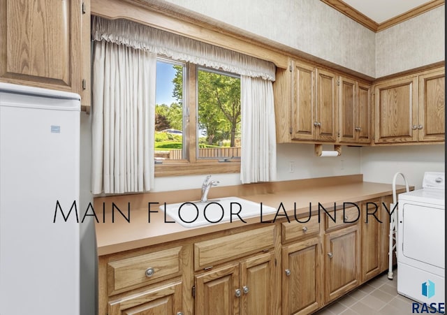 kitchen featuring light tile patterned floors and washer / dryer